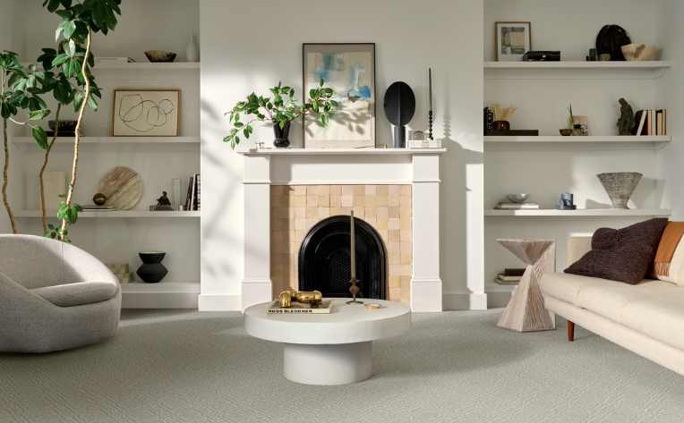 carpeted lounge room with fireplace