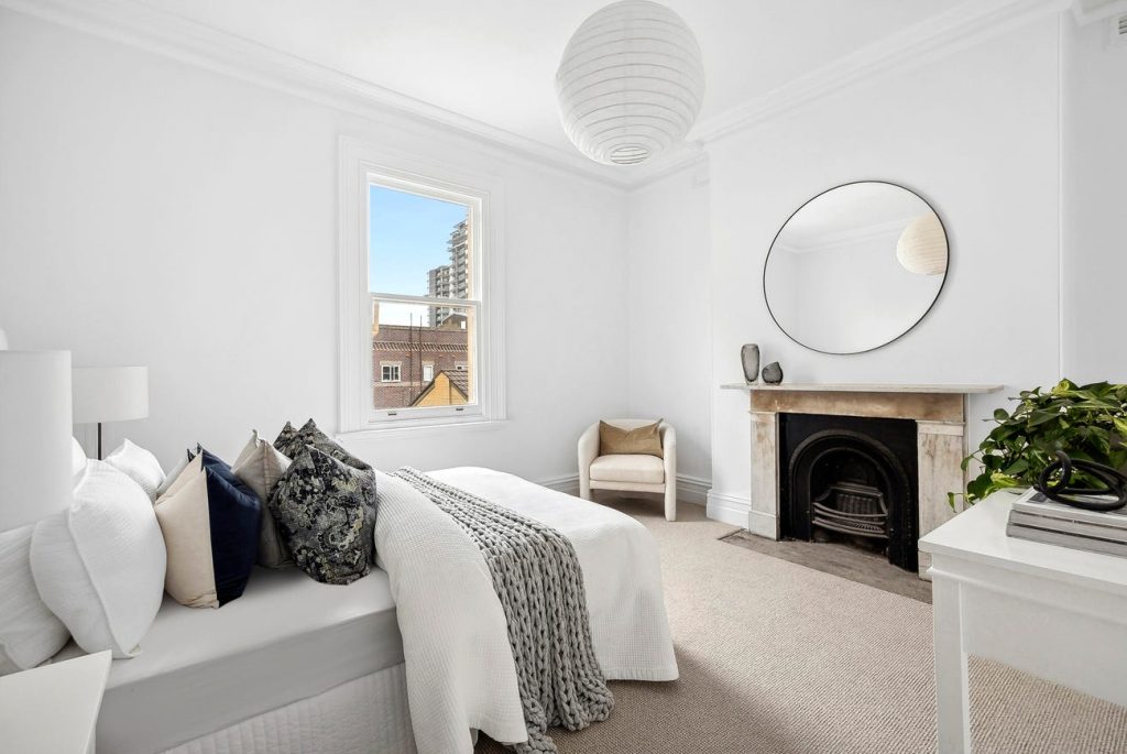 bedroom carpets with fireplace